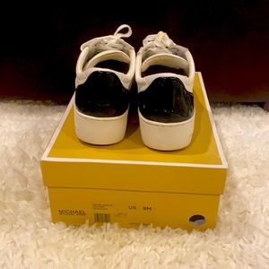 White and dark navy sneakers